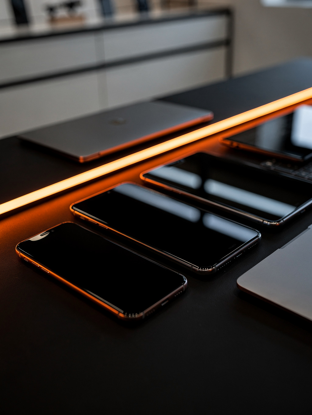 Modern consumer electronics setup featuring smartphone and laptop